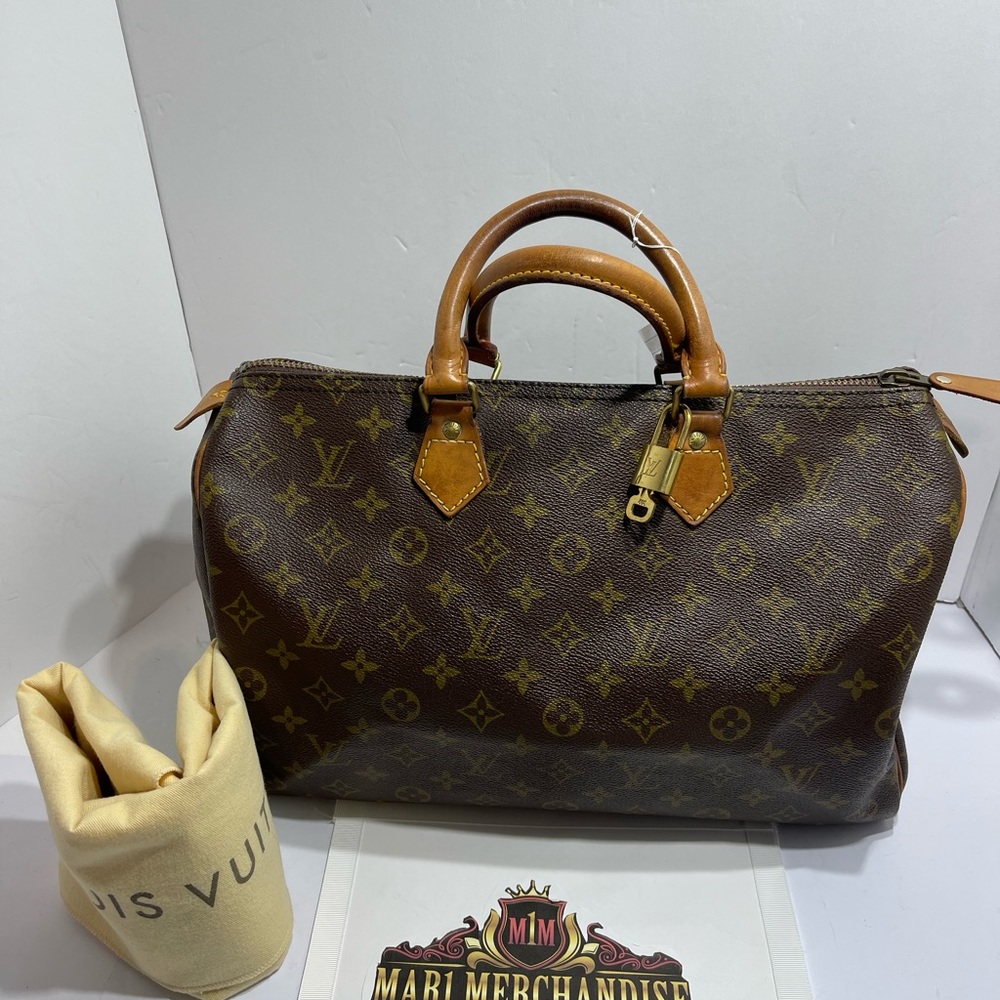 Louis Vuitton Speedy 35 in Monogram comes with lock , key and dust bag,preloved.